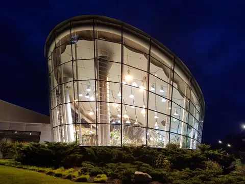 The Strong National Museum of Play illuminated at night in Rochester, New York